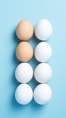 a group of eggs arranged in a row on a blue surface
