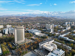 Fototapeta premium Hotel Kazakhstan with a view of various residential and commercial buildings and the central streets of the city.