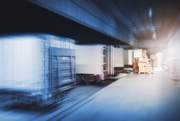 Fototapeta premium Container Trucks Loading at Warehouse Port at Night. Package Boxes Pallets Shipment. Cargo Container Delivery Trucks. Distribution Warehouse. Freight Trucks Logistic, Cargo Transport.