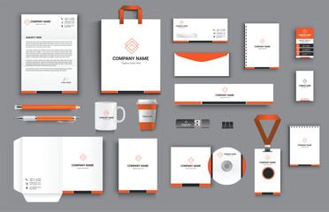 office business stationary set in orange black white color vector design with letter head envelop folder id card notepad dvd cover usb paper clip pen pencil cups business card shopper - obrazy, fototapety, plakaty