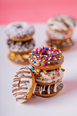 Chocolate donuts, on a pink background.