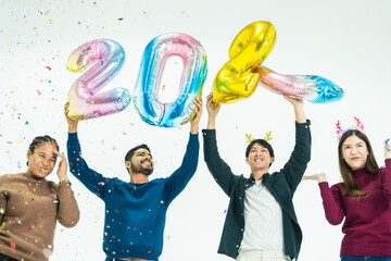 group of people holding fantasy color balloons bubble of the number 2024 for the new Year. men and...