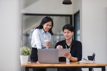 Two businessmen discussing project strategy in office conference room Businessman discusses project planning with colleagues in modern workplace Discussion and advice about financial reports