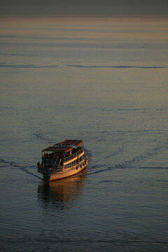 Large transport boat with people crossing Lake Ohrid