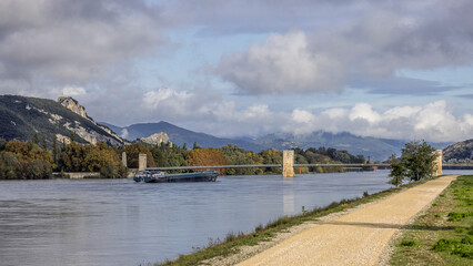 Fototapeta na wymiar River transport barge on the Rhône at Donzère