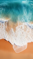 Aerial view of ocean waves and sandy beach in summer