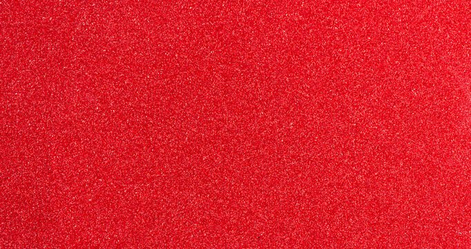 Red paper glitter texture christmas background.