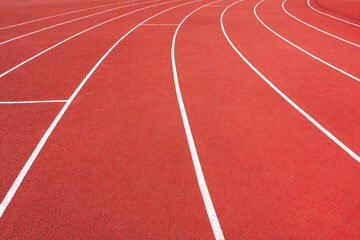 Fototapeta premium close up red running track, sports court or playground background with white line.
