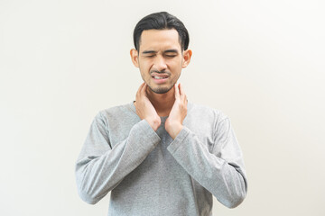 Sick, hurt asian young man sore throat pain, have a fever, flu check self touching massage neck....