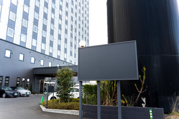 Fototapeta premium Billboard Mockup in Front of Office Building