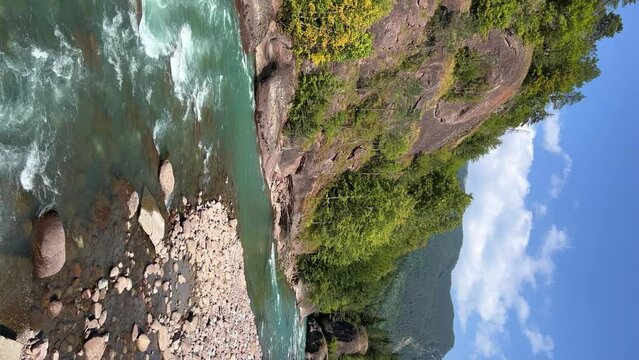 The Bolshaya Laba River. A mountain emerald river in a narrow, sunlit canyon. Bolshaya Laba River near the village of Psemen in Karachay-Cherkessia, Russia. Panoramic view. 4K