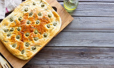 Focaccia with olives and rosemary. Italian food. Vegetarian food.