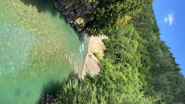 The Bolshaya Laba River. A mountain emerald river in a narrow, sunlit canyon. Bolshaya Laba River near the village of Psemen in Karachay-Cherkessia, Russia. Panoramic view. 4K