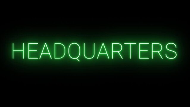 Flickering neon green glowing headquarters text sign animation on black background.