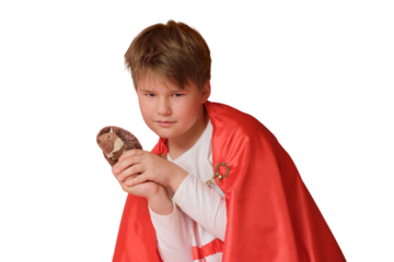 Little boy dressed like superhero holding a toy, isolated on white background
