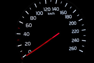 Close up shot of speedometer in car. Car dashboard. Dashboard details with indication lamps.Car instrument panel. Dashboard with speedometer.