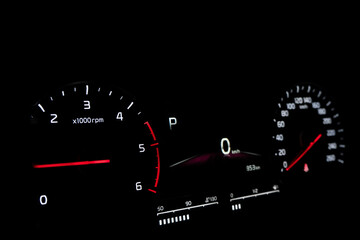 Close up shot of speedometer in car. Car dashboard. Dashboard details with indication lamps.Car instrument panel. Dashboard with speedometer.