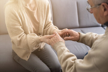 Obraz premium Close up anxious serious old man listening to female doctor at meeting in hospital, therapist physician consulting mature patient about disease, treatment, elderly generation healthcare concept
