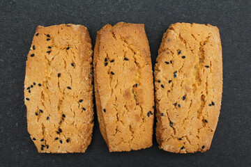 Salt Black cumin cookies on black background close-up view 
