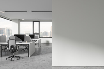 White workplace interior with pc computers and table, mock up wall