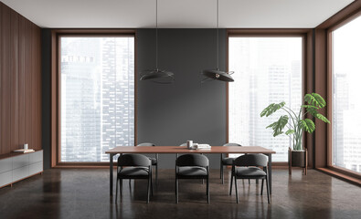 Dark living room interior with table and seats, drawer and panoramic window