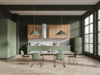 Dark green and wooden kitchen interior with dining table