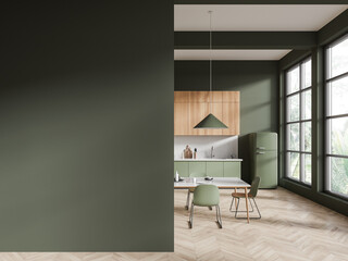 Green hotel kitchen interior with dining table near window. Mock up wall
