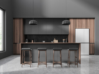 Dark home kitchen interior with bar counter, cooking space and window