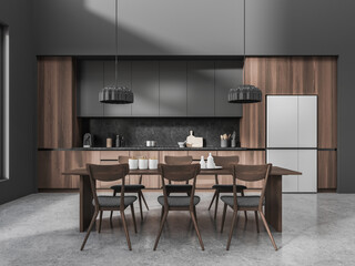 Gray and wooden kitchen interior with long dining table