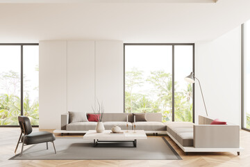 Luxury hotel living room interior with sofa and coffee table, panoramic window