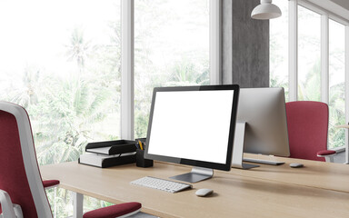 Modern office interior with pc desktop on table with mockup display, window