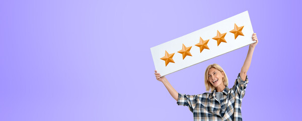 Laughing woman showing up signboard with five stars rating on em