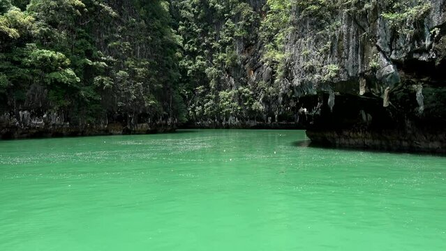 Footage of beautiful turquoise blue green coloured lagoon is a shallow body of water separated by a narrow landform such as reefs barrier or islands peninsulas or isthmuses 4k high resolution quality