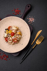 Delicious fresh salad with chicken, quail eggs, cherry tomatoes, lettuce