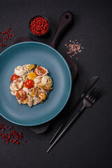Delicious fresh salad with chicken, quail eggs, cherry tomatoes, lettuce
