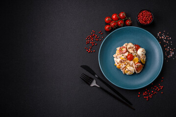 Delicious fresh salad with chicken, quail eggs, cherry tomatoes, lettuce