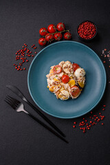 Delicious fresh salad with chicken, quail eggs, cherry tomatoes, lettuce