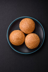 Delicious fresh crispy white round bread with seeds and grains