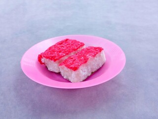 Sengkulun cake, a traditional cake made from sticky rice flour and grated coconut then steamed. Sweet wet cakes are usually served at events or as snacks at home. awuk-awuk, kue sengkulun. 
