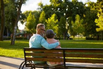 Happy couple enjoying tranquility and idyllic atmosphere in park