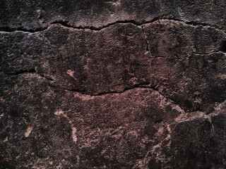 Grungy wall of gray concrete texture with cracked surface from sand and cement materials.