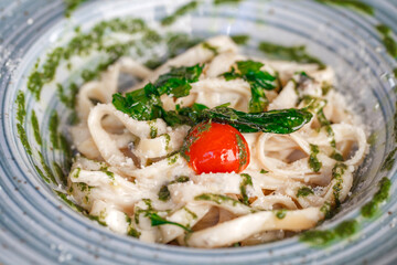 Italian fettuccine pasta with cheese, close-up, selective focus