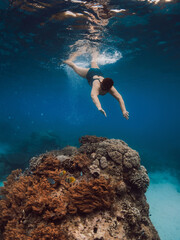 60s woman snorkeling in blue ocean. Snorkeling at vacation in Hawaii