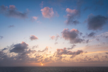 Beautiful dramatic Summer dawn over Lizard Point in Cornwall UK with lovely glowing sky and clouds