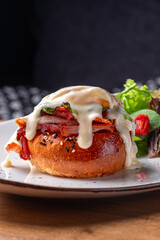 Eggs Benedict- toasted English muffins, ham, poached eggs, and delicious buttery hollandaise sauce