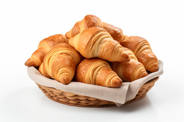 a basket of croissants on a white surface