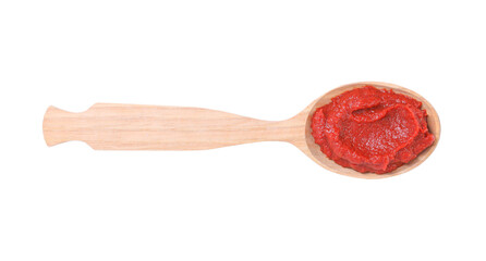 Wooden spoon of tasty tomato paste isolated on white, top view