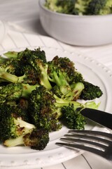 Tasty fried broccoli served on white table, closeup