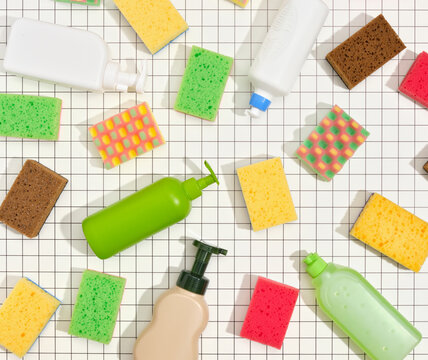Top view of composition with cleaning supplies for dish washing. Home hygiene routine.