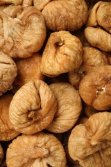 Many tasty dried figs as background, top view